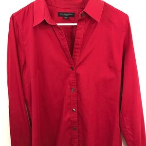 A dark pink button down shirt (Long sleeve)